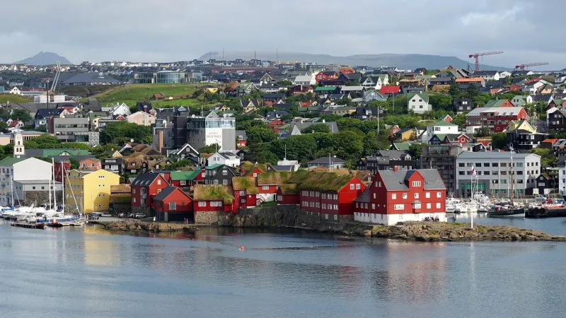 Torshavn, Faroe IslandsTórshavn, the capital city of the Faroe Islands with 13958 inhabitants (2022), is a charming destination that seamlessly combines old-world charm with modern comforts. Surrounded by stunning landscapes, this vibrant city offers visitors a range of experiences.